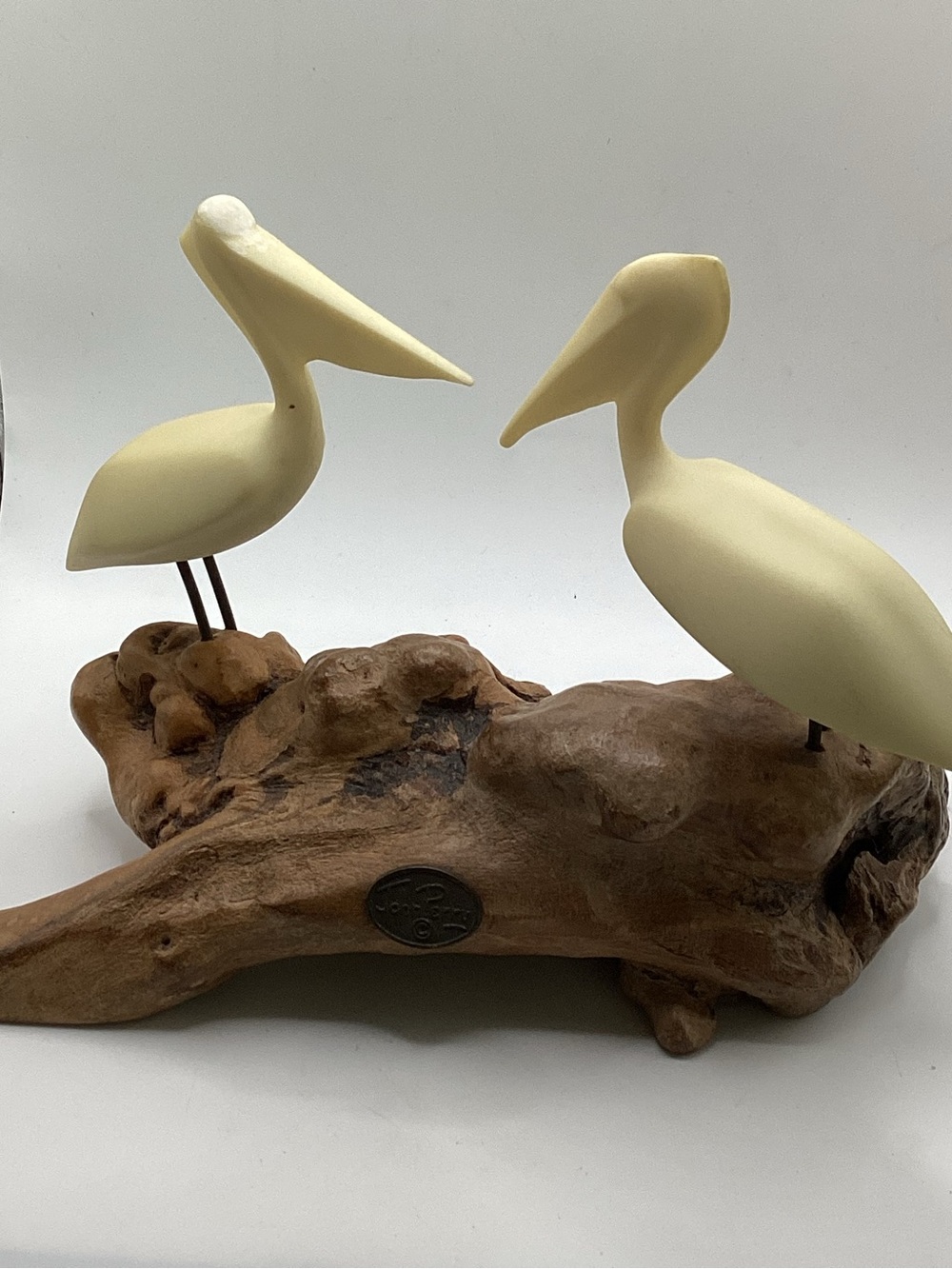 vintage John Perry sculpture featuring two pelicans perched on a burl wood base